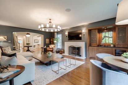 Beige or tan sectional couch with the chaise closest to the camera