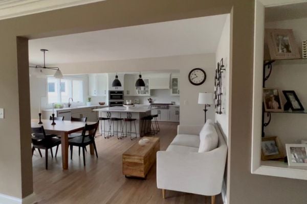 Contemporary kitchen with matte black lighting fixtures and a low top ebony dining table