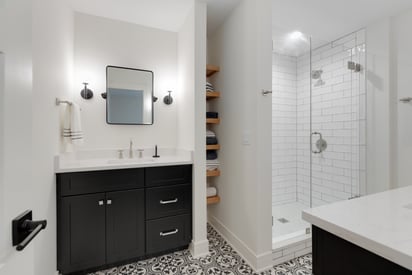 Bathroom with a hidden storage nook between the vanity and shower