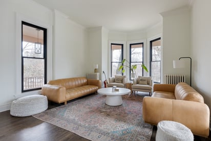 Seating room and living room with rounded beige sofas