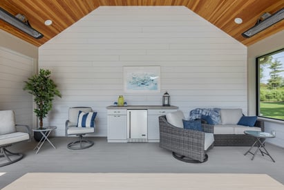 Pool house interior with a roof covering the seating area