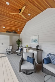 Wooden ceiling and a 3 blade ceiling fan mounted in a pool house shed