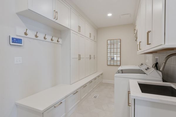Large mudroom and laundry room attached to remodeled kitchen
