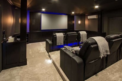 Basement home theatre with reclining theatre chairs and mood lighting