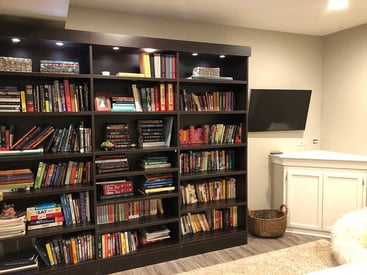 3 large bookshelves full of books