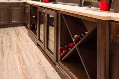 Wooden kitchen island with wine bottle storage and a wine cooler built in