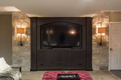 Luxurious fireplace built into the wall of a finished basement