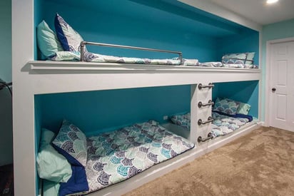 Basement bunk beds with four areas to sleep with matching comforter sets