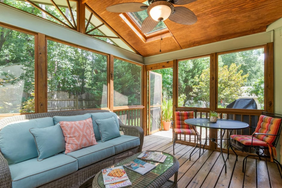 A sunroom built on a wooden deck | Hogan Design and Construction