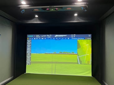 Fully built-in golf simulator in a corporate office building