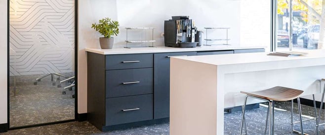 Private office with multiple desks and a textured mirror