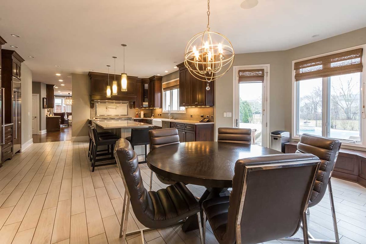 Kitchen remodel in residential home with leather and chrome dining room chairs