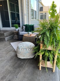 Outdoor seating area with lots of plants and vegetation