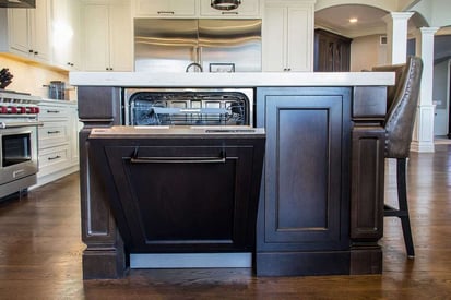 dishwasher built into the kitchen island with the door halfway open