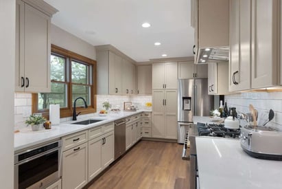 kitchen with luxury vinyl plank flooring and built in can lighting