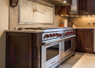 Kitchen stove with 10 red knobs and two different doors for baking space