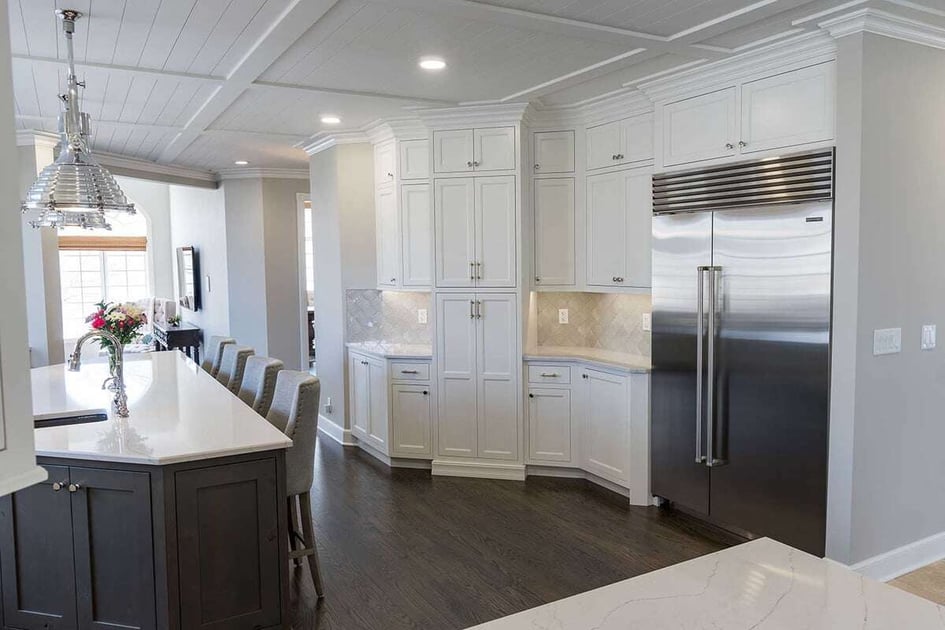 A white kitchen with inset cabinets