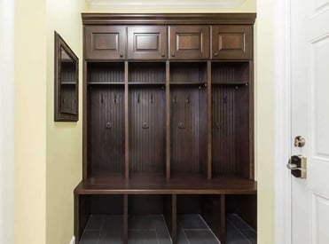 Spacious mudroom with plenty of hooks for jackets and cubbies to store shoes