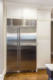 two door stainless steel fridge with a smaller freezer door than fridge door