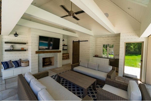 Pool house recreation room with tv and sitting area