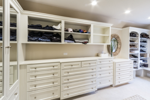 HDC laundry room with organized clothes and drawers