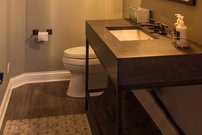 Guest bathroom with a single vanity countertop and pastel colors