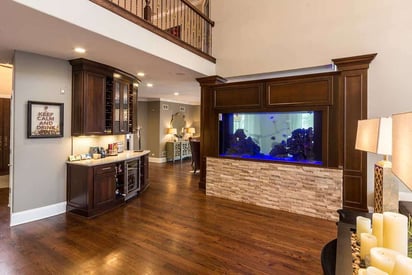 Living room and kitchen visible from the front door of a million dollar home