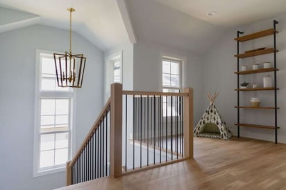 Home second story landing overlooking the foyer and banister