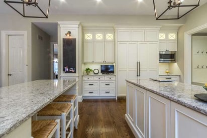 Kitchen with two islands, one with seating areas, and the other for prepping when cooking