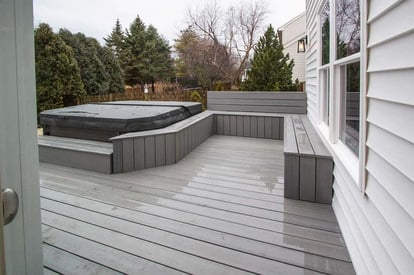 Porch with a built in hot tub and grey trexdeck