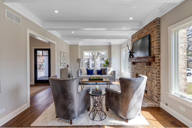 HDC living room with wing back chairs and brick fireplace